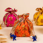 Close-up of vibrant Phulkari fabric potli