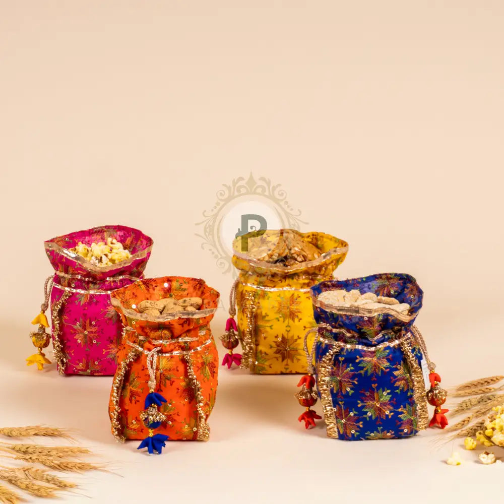 Set of four colorful Phulkari Potlis