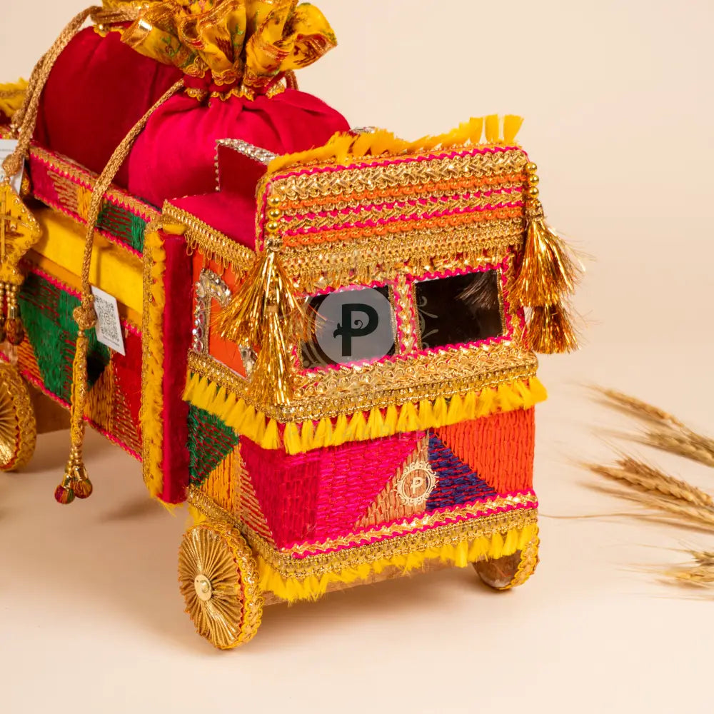 Close-up of vibrant truck design with silk tassels
