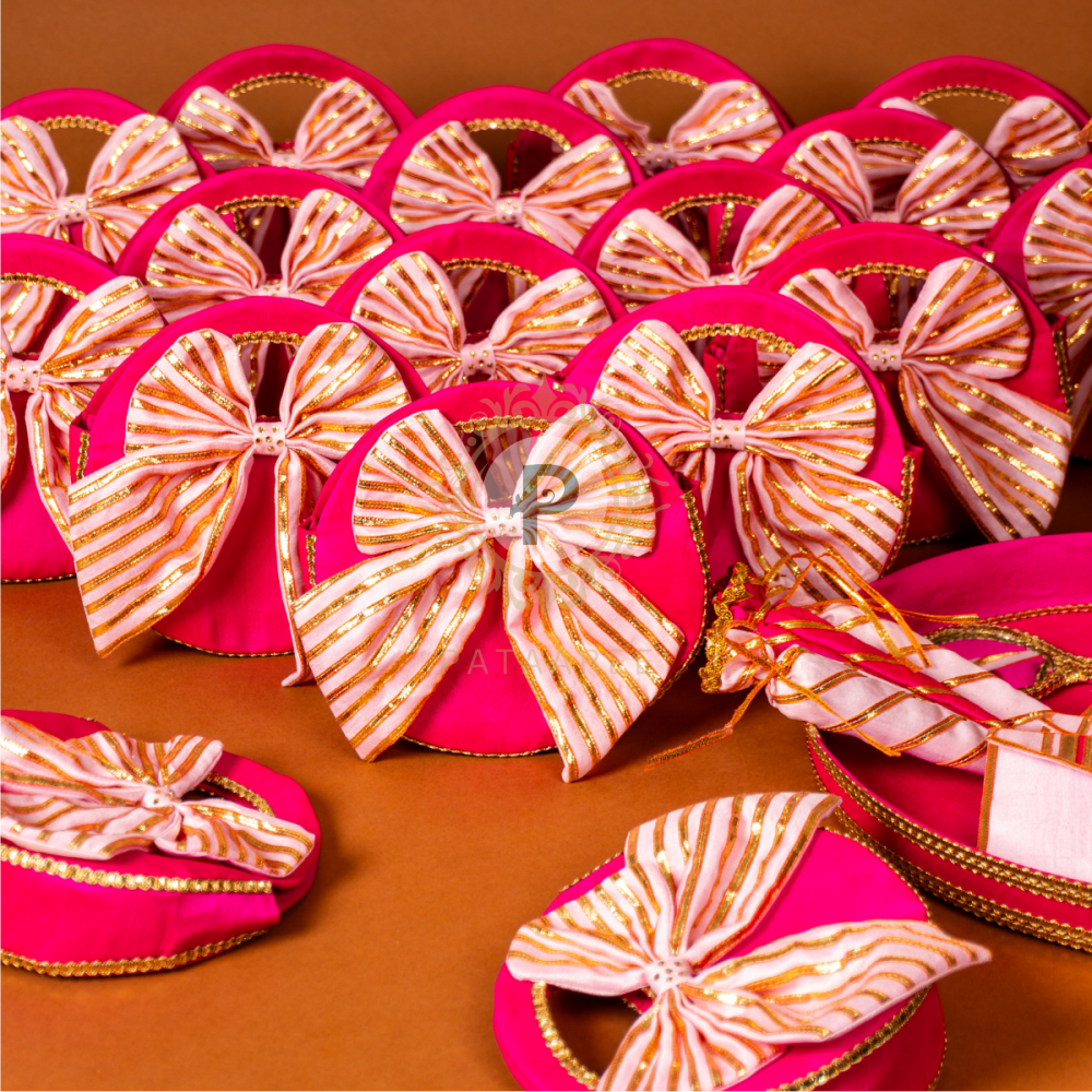 Pink and gold decorative items with bow designs